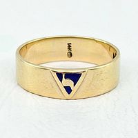 Front view of gold band with blue enamel triangular emblem