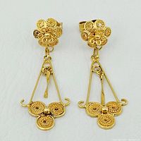 Front view of both earrings on white background