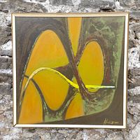 Front view of abstract painting in gold-painted wood frame