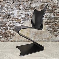 Side view showing S-shaped profile of chair from right side.