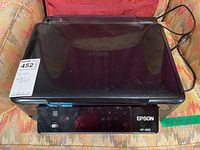 Front view of the Epson XP-400 printer and scanner showing model number and WiFi control panel.