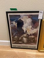Framed vintage New York Central System train print showing detailed steam trains and dramatic clouds, size about 19x25 inches