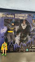 Front view of Batman 'Guardian of Gotham City' toy packaging featuring the Batman figure and city skyline graphics.