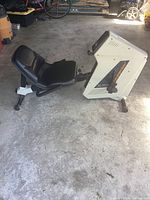 Side view of the white and black Cateye EC-3500 recumbent exercise bike showing the seat, frame, and resistance lever.