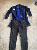 Full outfit laid out flat showing dark blue denim jacket buttoned open over a royal blue shirt paired with black pants, all size 18.