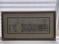 Full view of framed print showing wrought iron fence artwork.