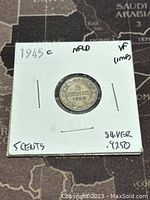 Front side of the 1945C Newfoundland 5 cents silver coin showing denomination and year.