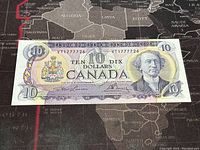 Front of the 1971 Canadian $10 banknote showing portrait of Sir John A. Macdonald, serial number, and denomination.