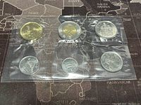 Seven Canadian proof-like coins from 2020 in sealed protective plastic, showing both $2 toonie and lower denominations.