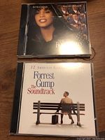 Photo of two CD jewel cases: The Bodyguard soundtrack and Forrest Gump soundtrack