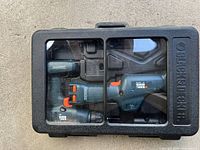 Front view of the closed Black & Decker Versapak carrying case showing drill and saw inside.