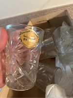 Close-up of Anchor Hocking Prescut clear drinking glass with original gold label