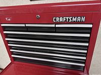 Front view of closed red Craftsman tool chest showing eight drawers and brand logo