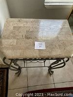 Top view of a rectangular stone top with beige natural patterns on the wine rack.