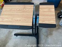 Top view of the portable desk showing wood textured two tabletops with black edges