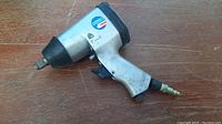 Photo of the 1/2 inch air impact wrench showing the metal build and connection for air hose.