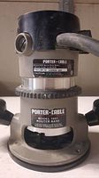 Close-up of the router showing model 6902 heavy duty motor and model 1001 router base with Porter Cable branding