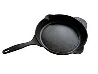 Side angle photo of Pioneer Woman cast iron frying pan with long handle and pouring spout visible