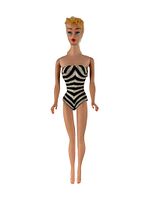 Full front view of doll wearing zebra striped swimsuit