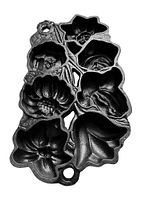 Full view of vintage cast iron baking pan with multiple floral molds and texture details.