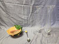 Photo showing a peach-shaped ceramic jam dish with a matching spoon and two etched glass bud vases.