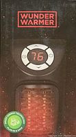 Front view of the Wunder Warmer heater showing digital temperature display reading 76 and heating element glowing red.