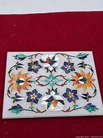 Full view of marble panel showing complete floral inlay design.