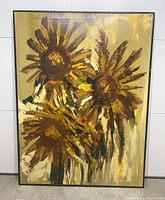 Frontal view of a large oil painting featuring three abstract sunflowers in a Mid-Century Modern style with dominant yellow and brown hues.
