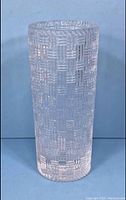 Full view of the vase showing the overall cylindrical shape and basketweave texture.