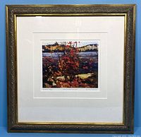 Framed print shown in entirety with ornate gold and brown frame and white matting.