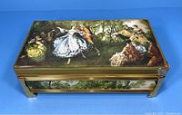 Top and side views show the detailed classical painted scenes with dancers and figures, decorative metal corner accents, and gold trim.