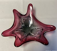 Top view showing star-like five-point freeform shape and purple-to-clear color gradient.