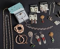 Collection of various costume jewellery including necklaces, bracelets, earrings, pins. Shows Napier branded earrings and adjustable hedgehog bracelet with tin.