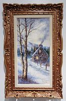 Full view of the framed oil painting showing winter landscape and detailed carved wood frame