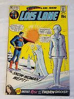 Close-up photo of the comic book cover showing Superman and a snow woman melting with clear title and issue information.