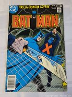 Straight on image of the 1978 Batman comic book issue 298 featuring Batman and a web design on the cover.