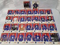 Top view of all the cards spread out showing full 1967 Leafs Stanley Cup team roster with player images and names.