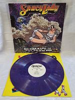 Purple translucent vinyl record with white center label for Saucy Lady Supanova.