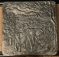 Top view of the vintage Arthur Court square silver serving platter showing embossed safari wildlife scene with elephants in the foreground.