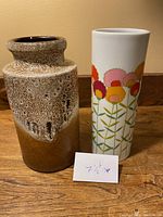 Photo showing both vases side by side with height note