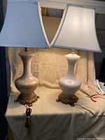 Two matching lamps front view with shades illuminated