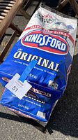 Photo showing a bag of Kingsford Original Charcoal Briquets with value size label and branding clearly visible.