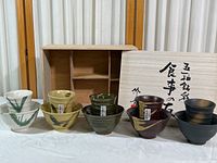 Full set displayed with wooden box behind