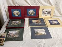 Eight Thomas Kinkade 8x10 prints with various colored mats including green, navy, beige, and red, showing cottage and landscape artwork.