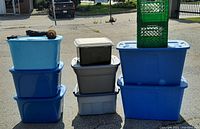 Stacked totes and crates showing varying sizes and colors, highlighting quantity and condition.