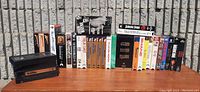 Photo of 21 VHS movie cases and vhs tapes, titles visible including Jurassic Park, Star Wars Special Edition, Shane, Gigi