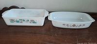 Two vintage glass bakeware dishes side by side showing pattern and shape