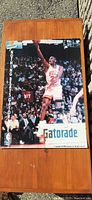 Full view of the front side of the Michael Jordan 1993 Gatorade poster showing him in action during a game, crowd in background and Gatorade logo at the bottom.