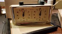 Front view of vintage Jantar USSR chess timer showing both clock faces and black push buttons on top