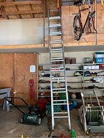 Full view of ladder leaning against mezzanine in garage